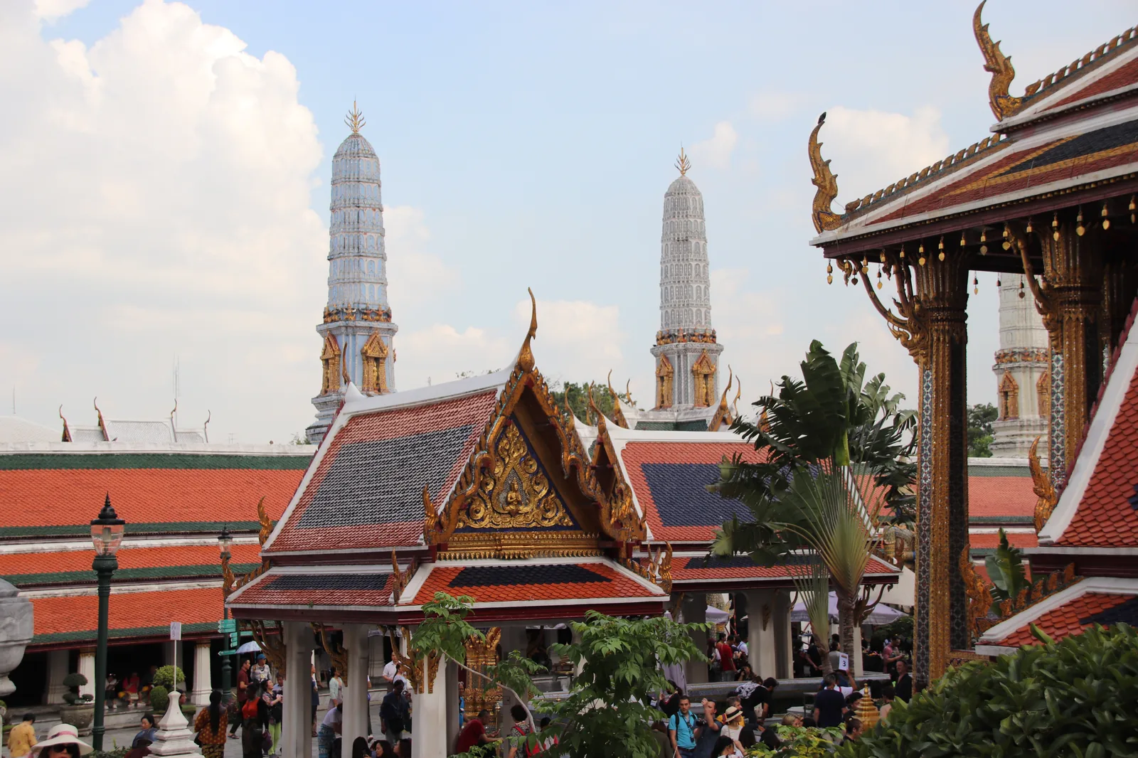 Wat Phra Kaew at the Grand Palace in Bangkok with orange temple roofs and golden spires